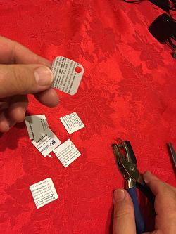 image of a tag with a hole punched in it